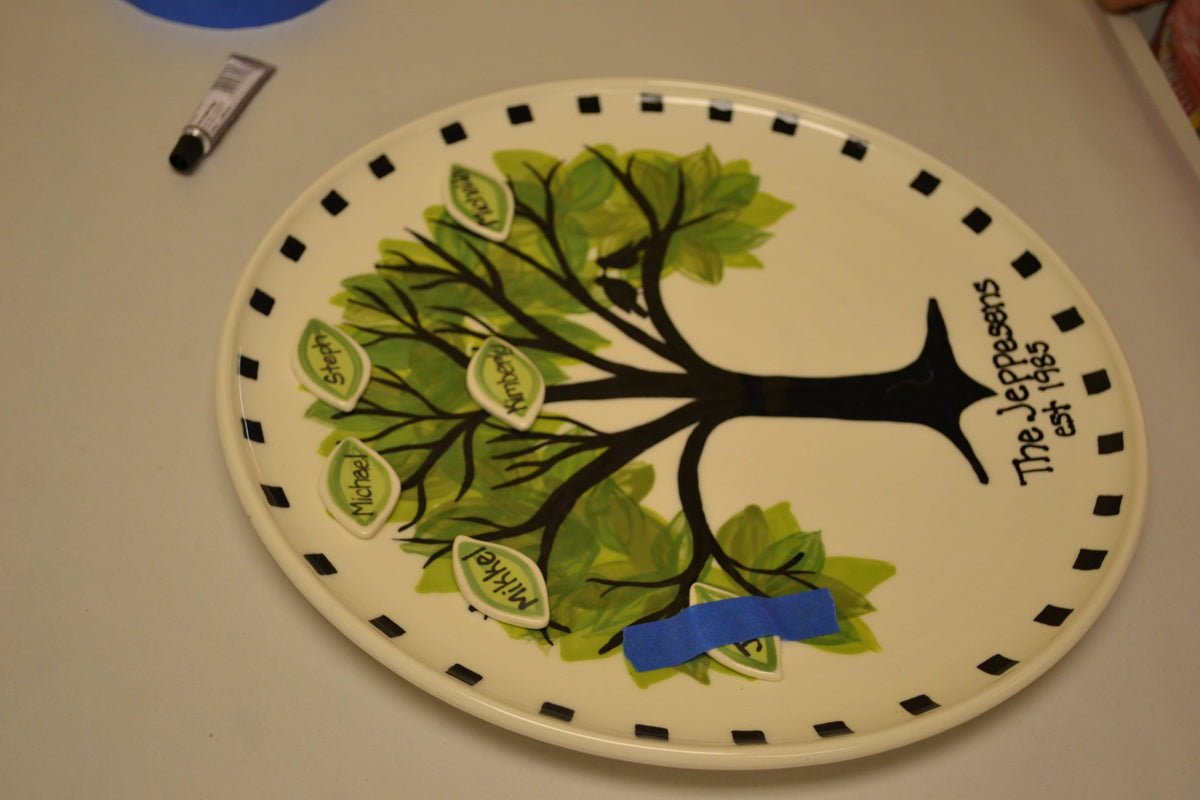 place a piece of tape over the leaf to secure it while it dries.
