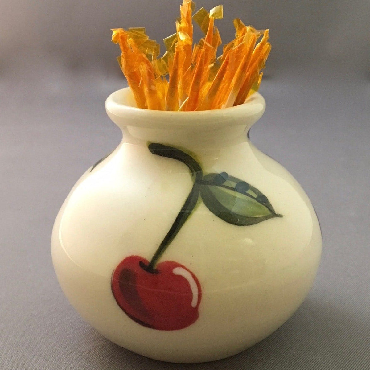 Cherry Small Vase with yellow toothpicks